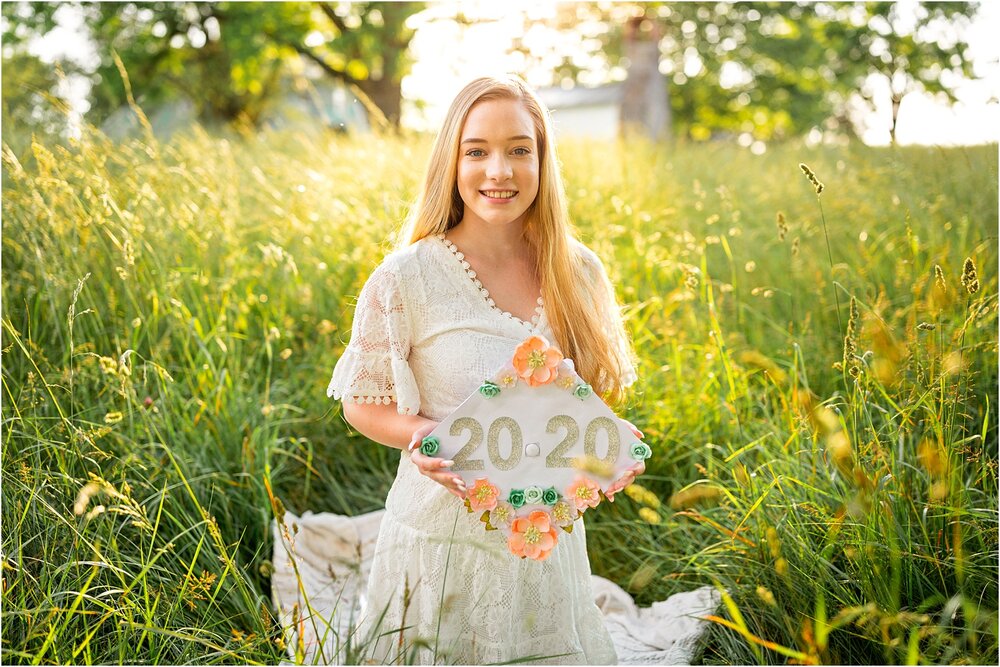 Senior photo of girl graduate with her decorated cap
