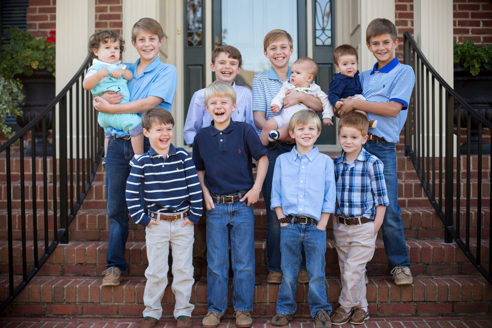 Boy cousins laughing at extended family portrait session