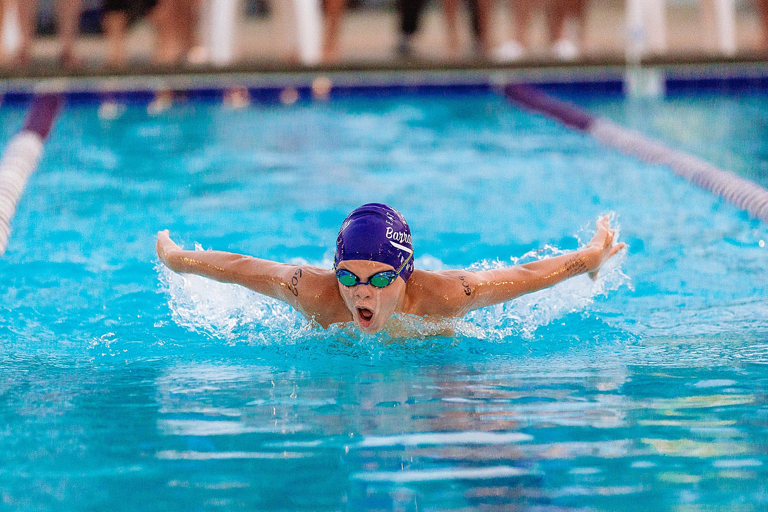 Boy swimming butterfly at summer swim league near Harrisonburg, VA