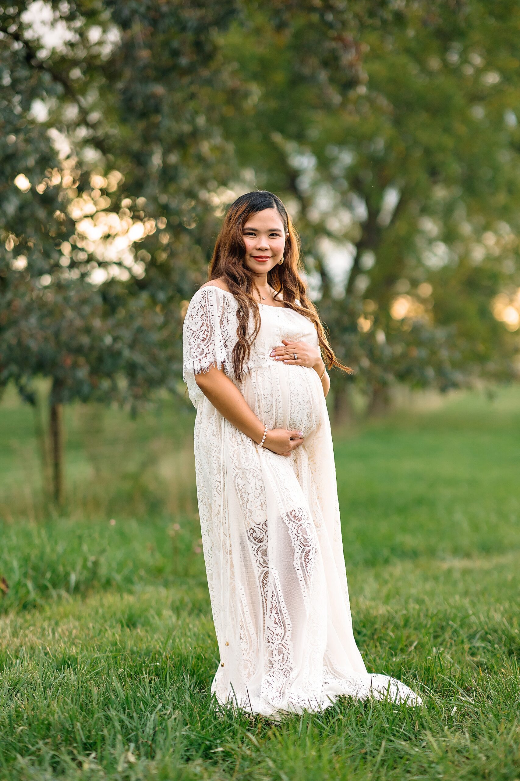Pregnant mom in white dress in a field Harrisonburg